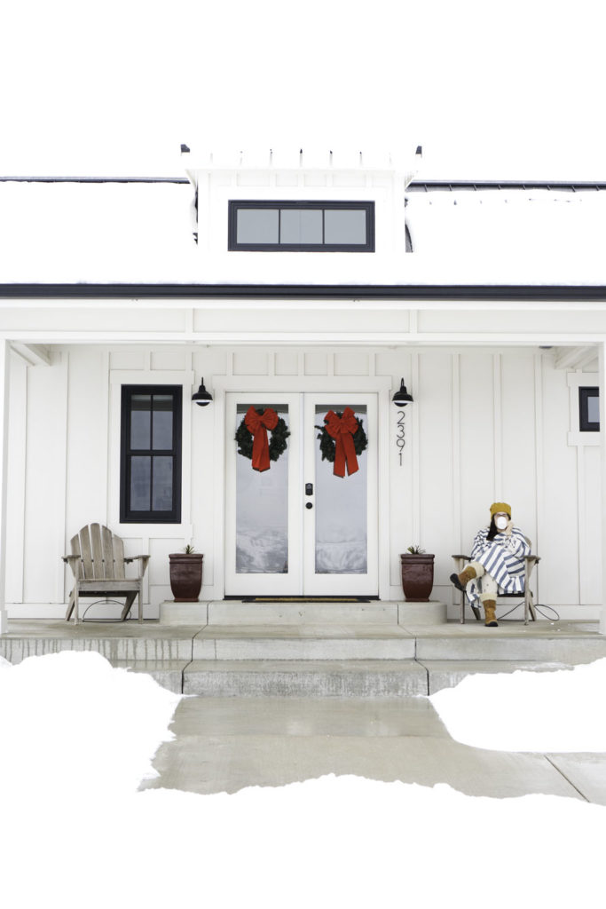 woman sitting on porch in snow