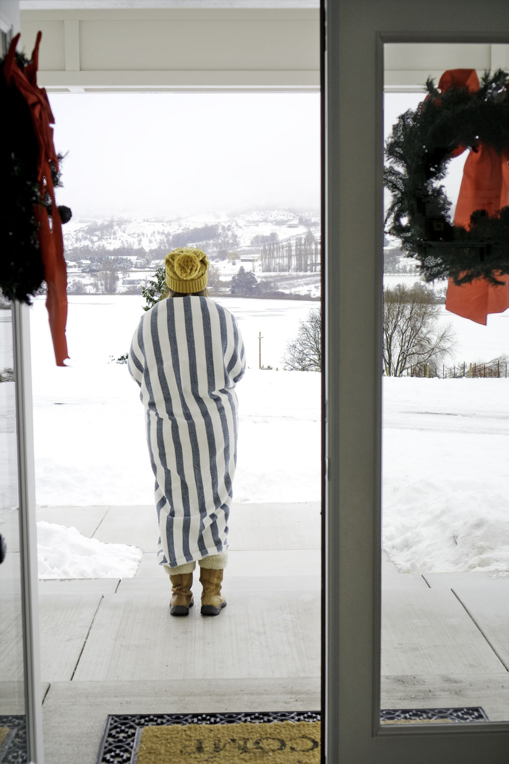 woman looking over Lake Chelan in winter