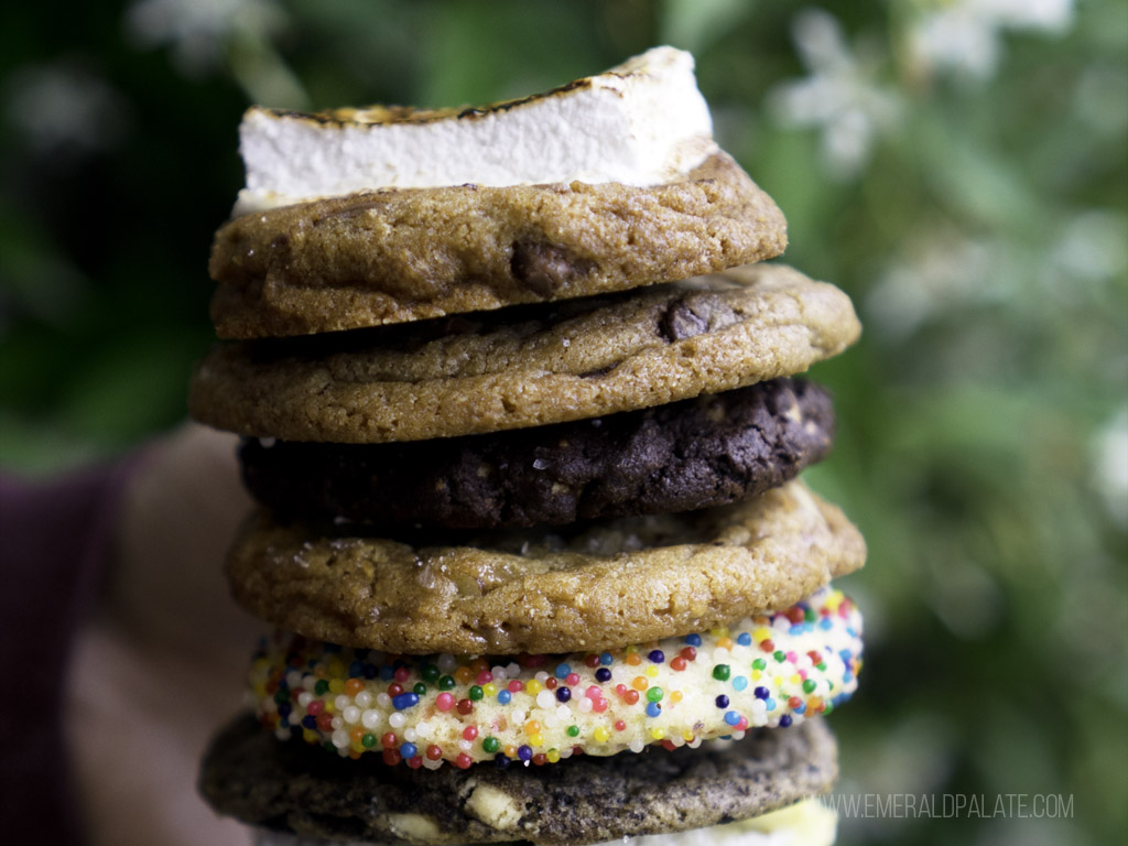 person holding stack of cookies from Seattle dessert delivery