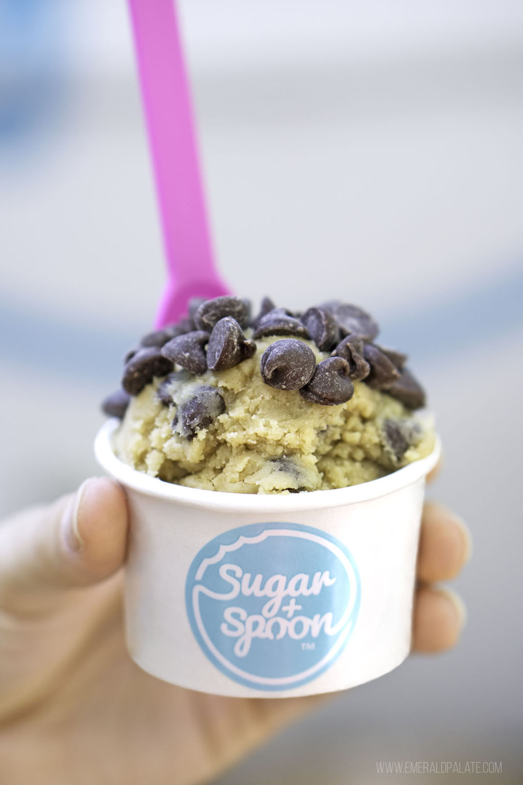 person holding cup of cookie dough from Seattle