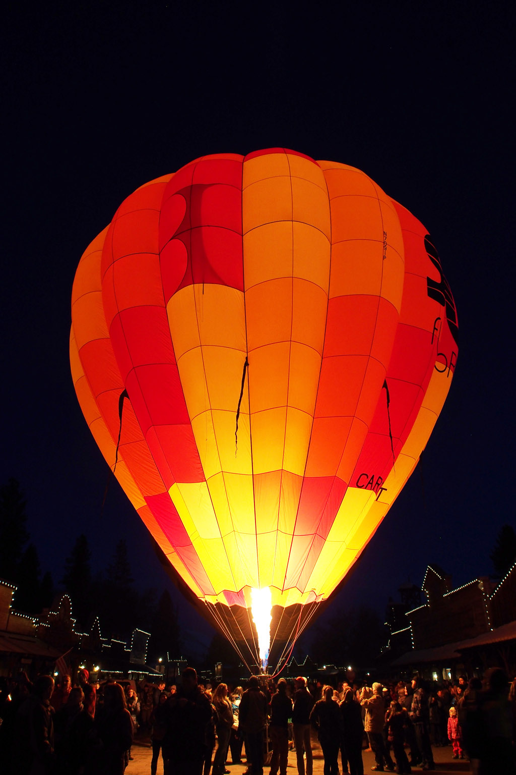 Hot air balloon glowing at night
