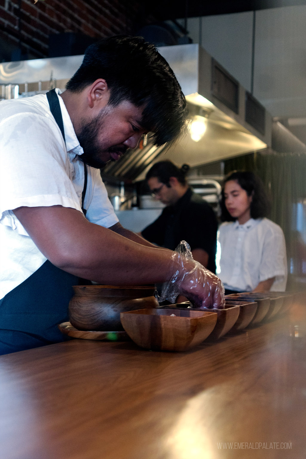 chef behind a chefs counter at a Seattle fine dining restaurant