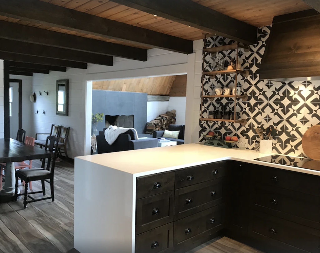 inside a modern cottage with geometric tile and beams