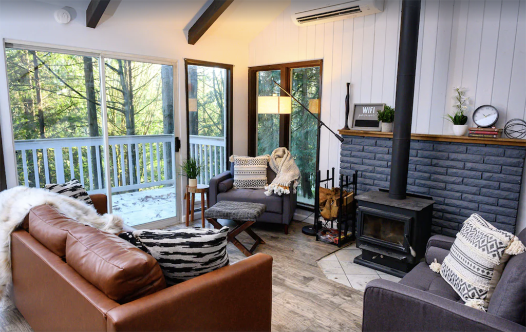 inside a modern cabin with wood-burning stove in one of Washington state's best winter cabins