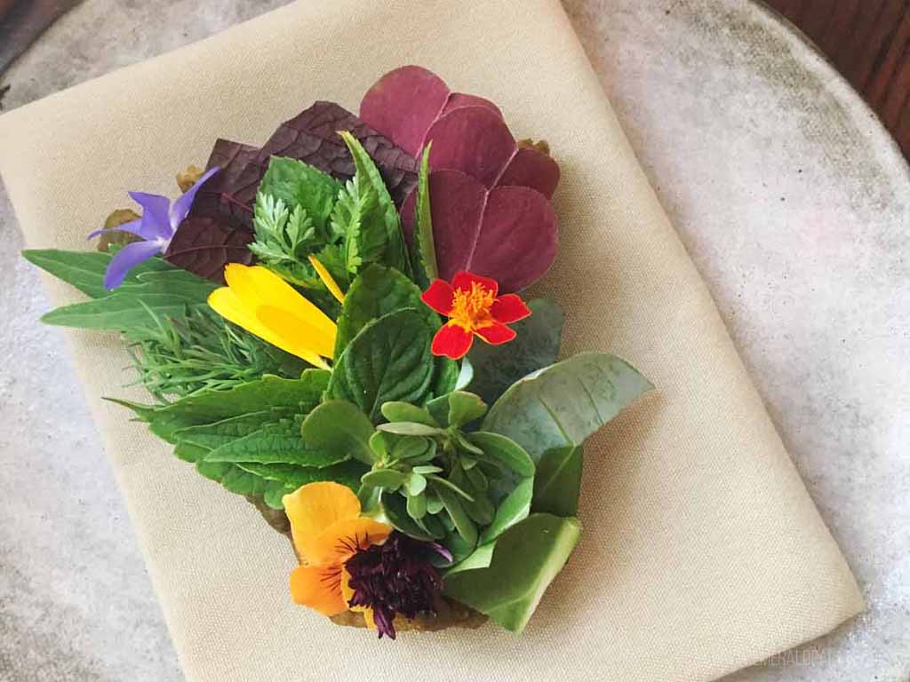 toast with intricately placed leaves on it from one of the best restaurants worth the drive from Seattle