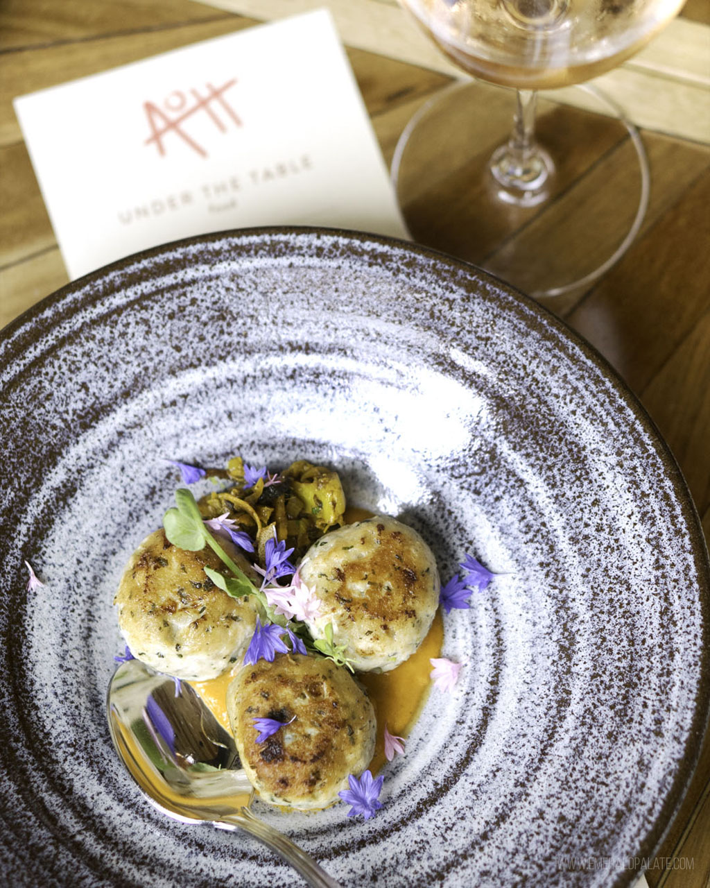 crab cakes on a plate from one of the best fine dining restaurants in Seattle