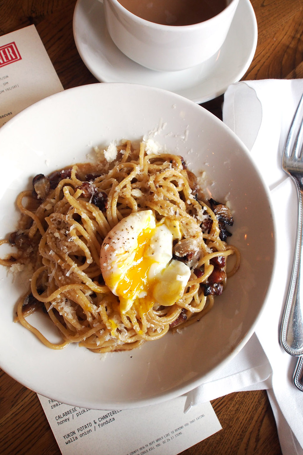 carbonara pasta with runny egg from a North Seattle restaurant