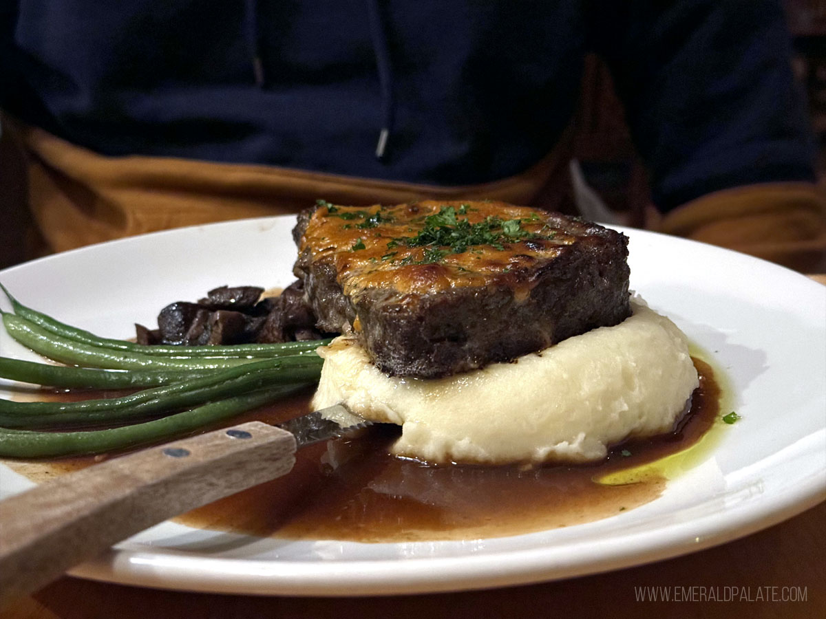 meatloaf on top of meshed potatoes with green beans rom a place to eat in Leavenworth