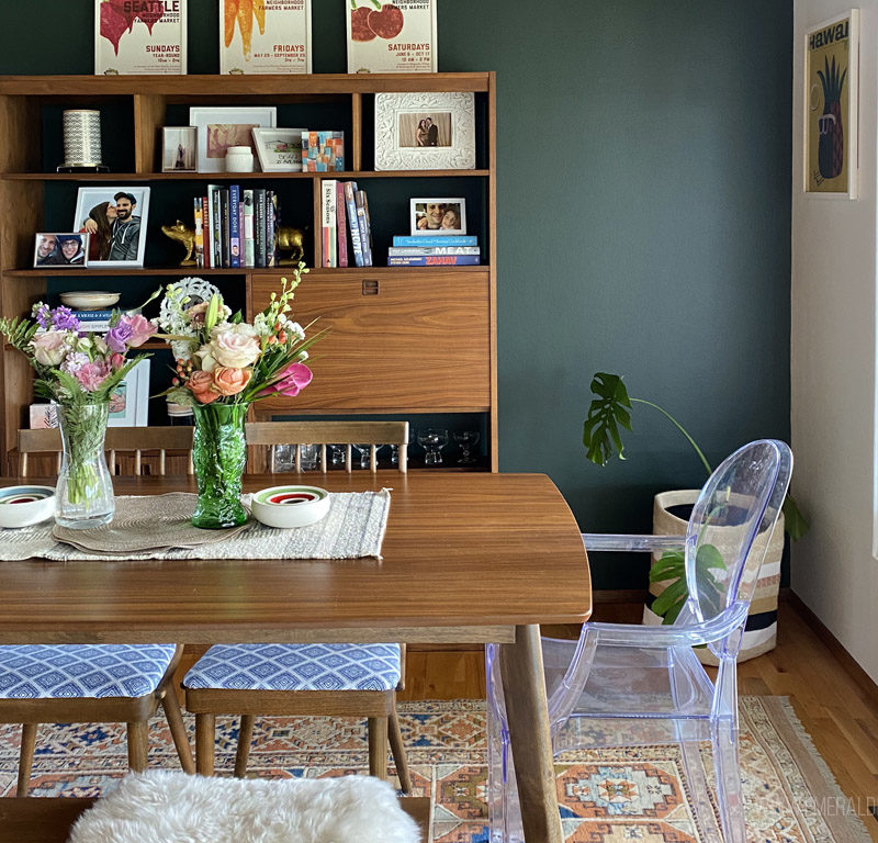 dining room with green wall and vintage furniture