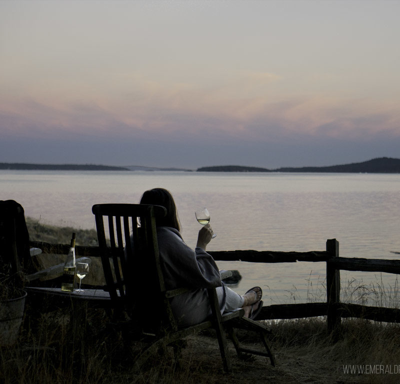 woman drinking wine at sunset