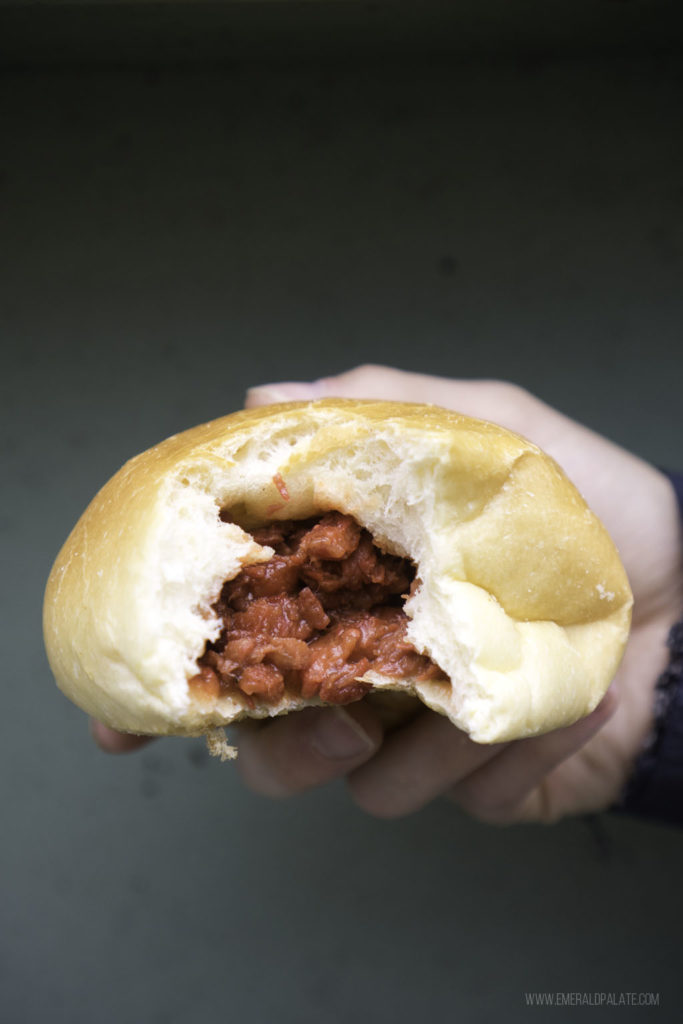 Chinese bao with bite and pork stuffing showing