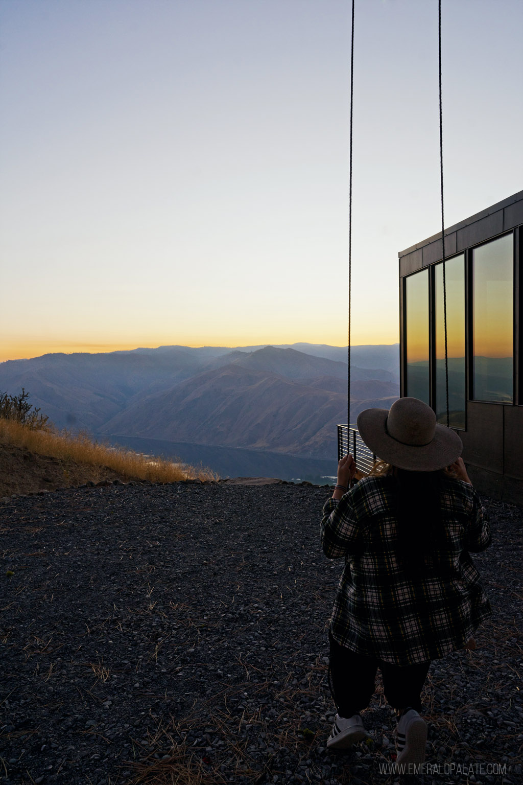 woman on a swing enjoying sunset at one of the most romantic Airbnbs in Washington state