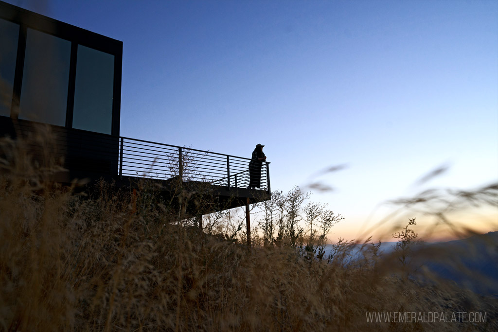 woman on the deck of a romantic vacation rental in WA