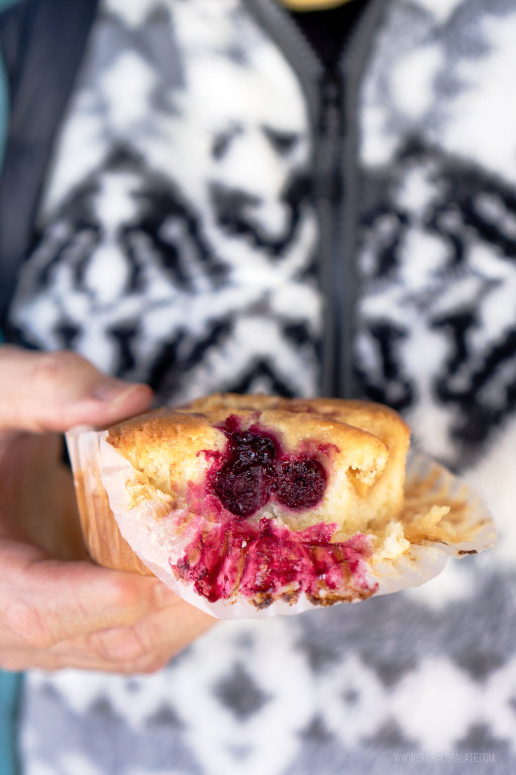 person holding sour cream coffee cake with raspberry filling from one of the best restaurants in Winthrop, WA