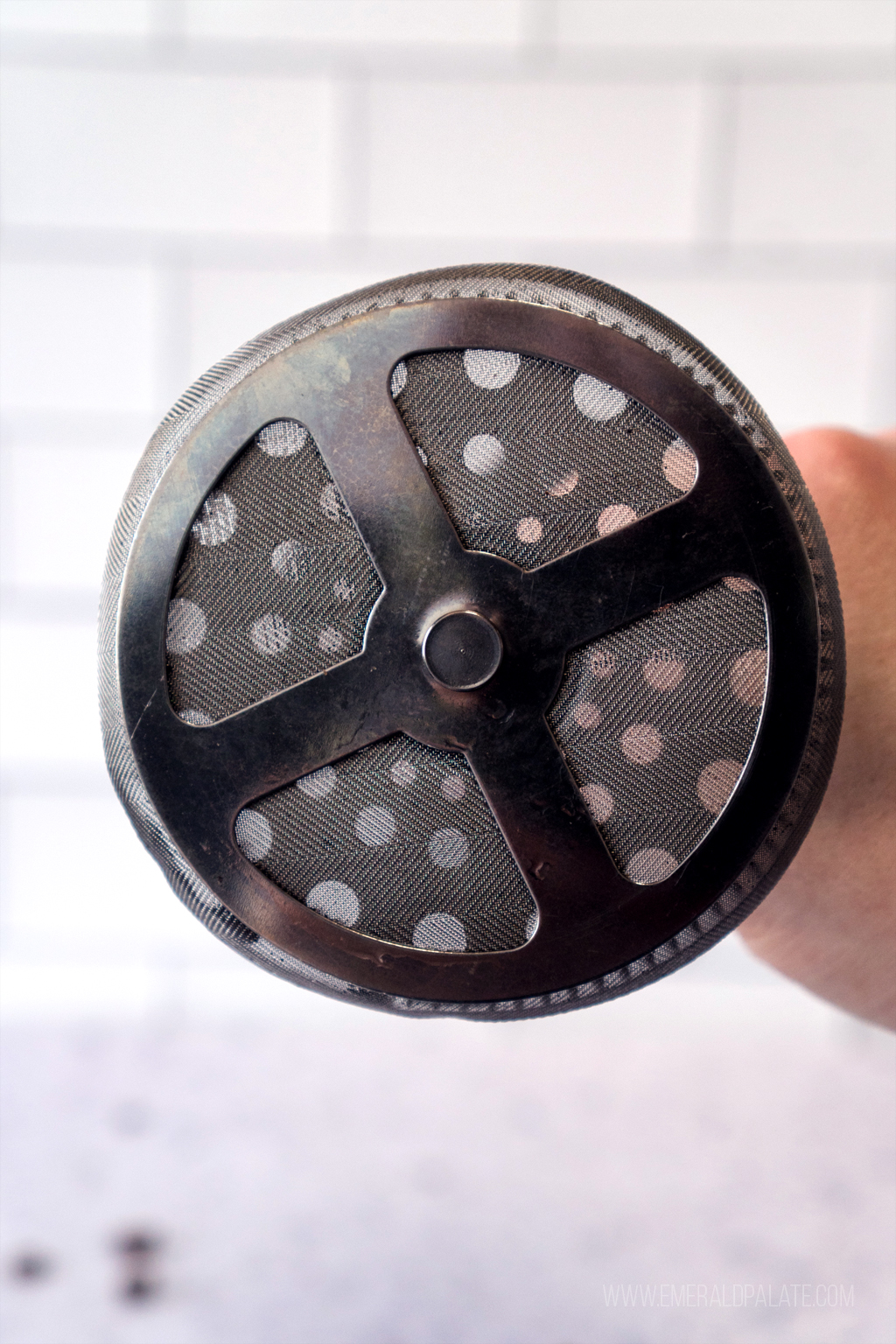 close up of a metal filter from a French press