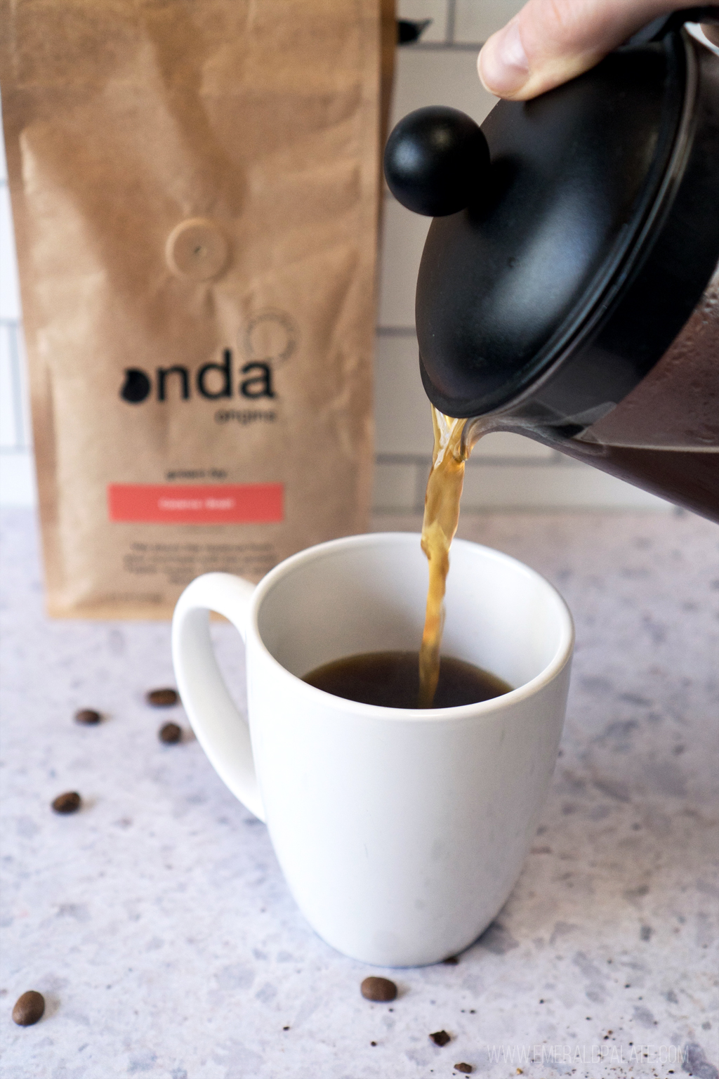 coffee being poured into a coffee mug