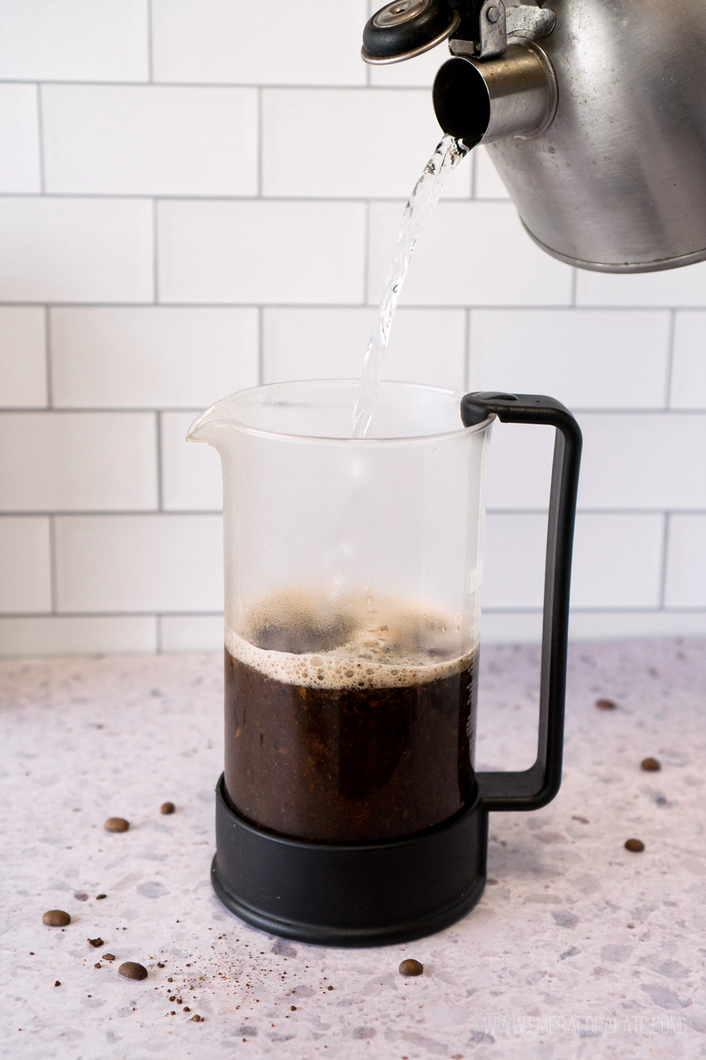 boiling water being poured into a French press