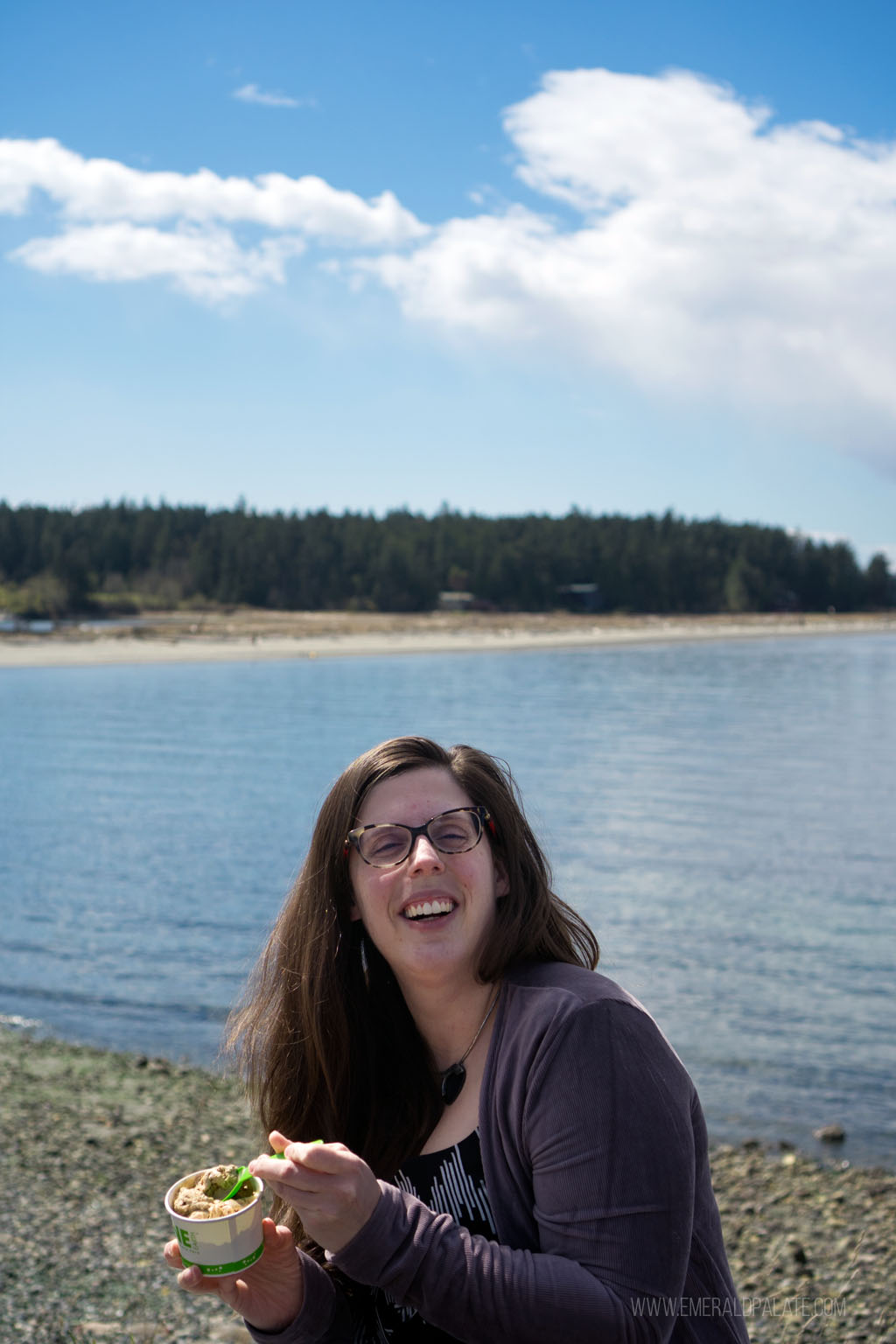 woman eating ice cream in front of Fisherman's Preserve in Lopez Village