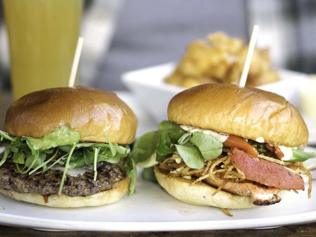 2 burgers on a plate from a family restaurant in Seattle