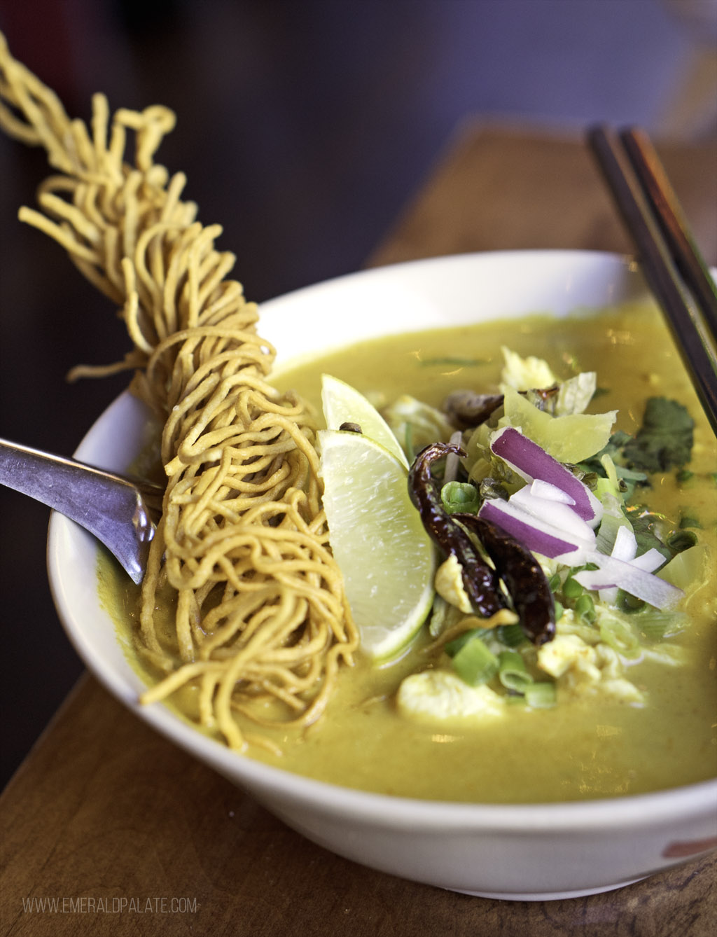 khao soi with a twirl of crispy egg noodles