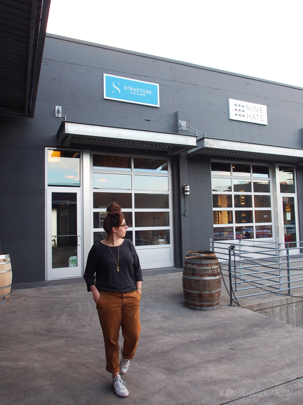 woman walking in front of one of the best Seattle urban wineries