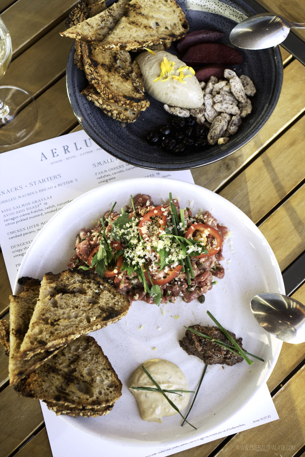 steak tartare and chicken liver mousse from a Seattle restaurant with water views