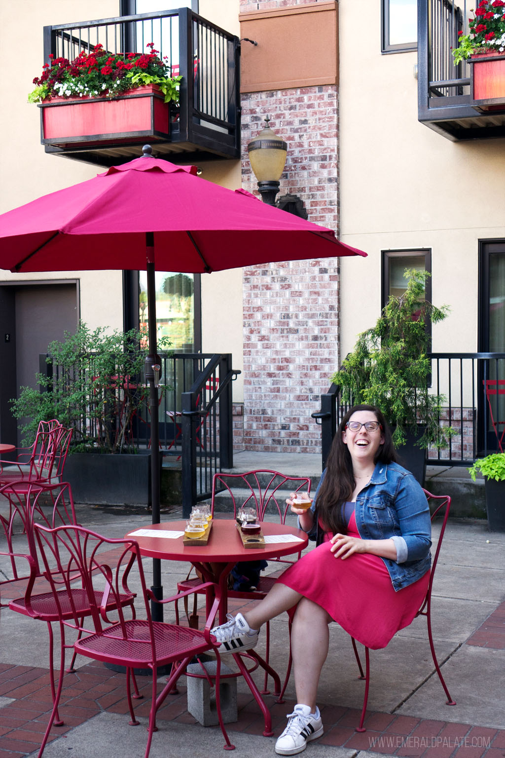 woman laughing while beer tasting outside at the 5th Street Public Market