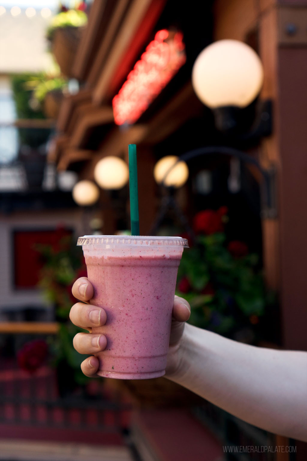 person holding smoothie in 5th Street Public Market