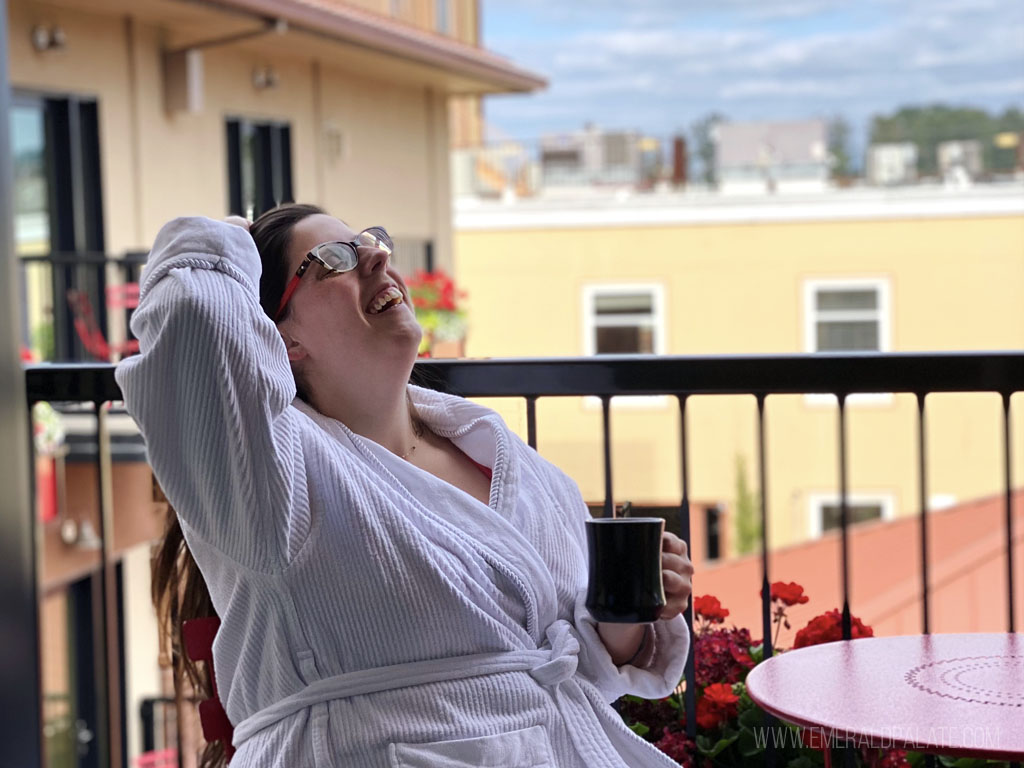 woman enjoying coffee at boutique hotels in Eugene, Oregon