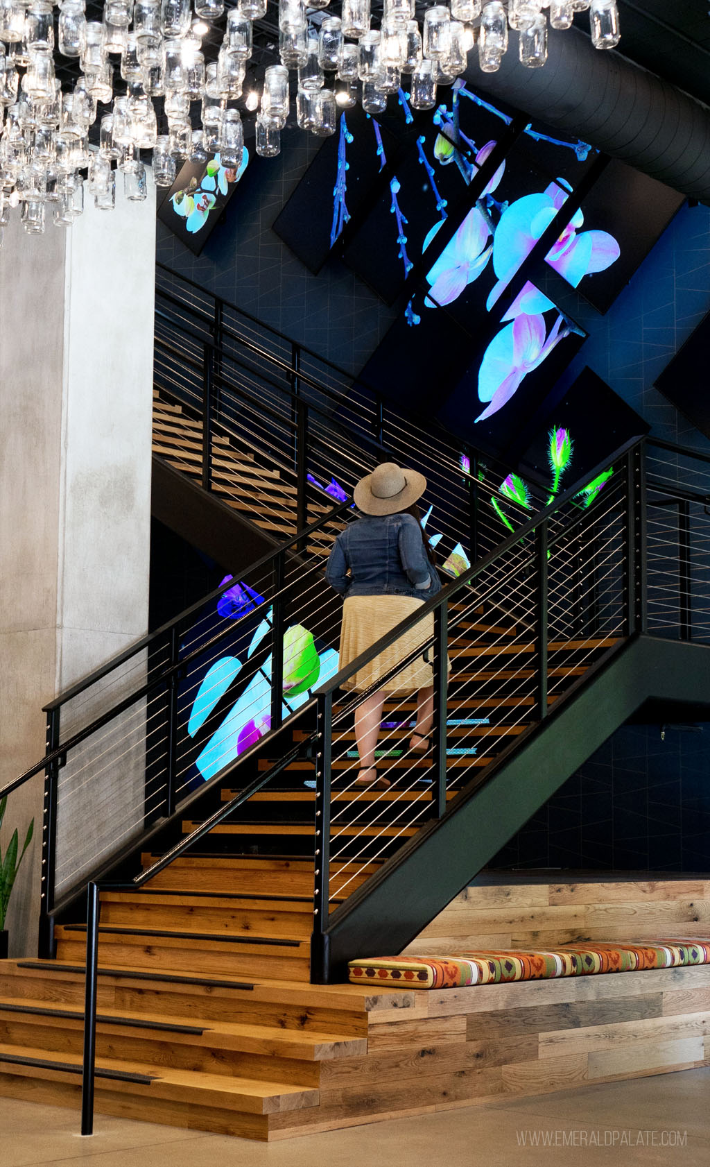 woman walking up steps at a Eugene boutique hotel