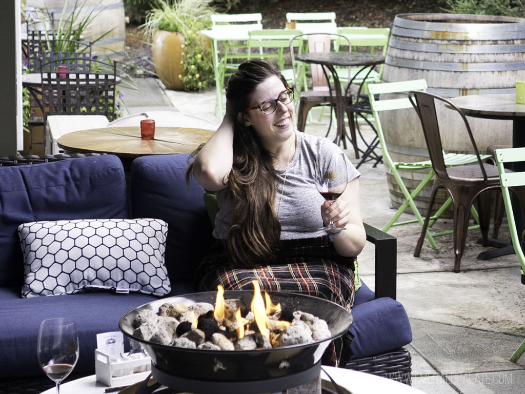 woman enjoying wine on one of the best Pacific Northwest tours