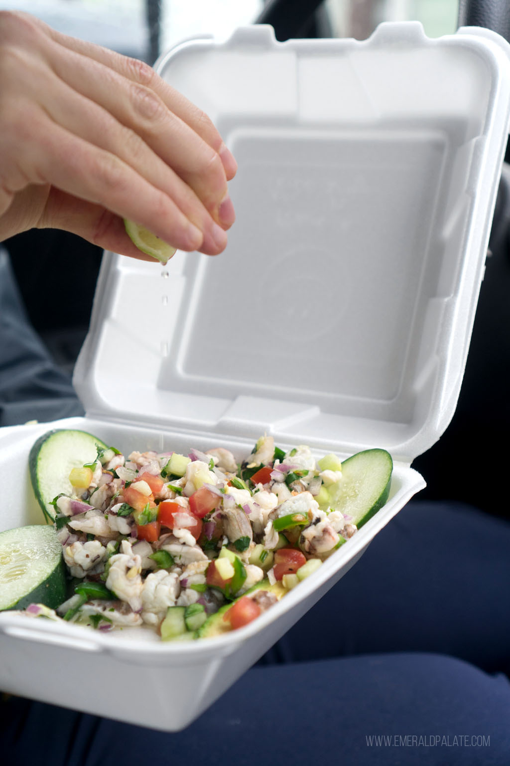 person squeezing lime over Mexican ceviche