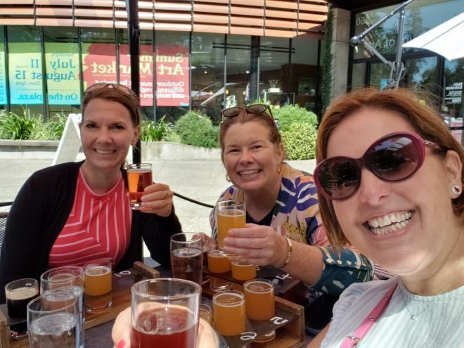 Friends beer tasting on a trip planned by a personal travel planner