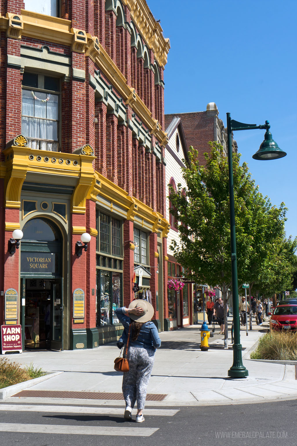 woman walking in the quaint historic downtown area of Port Townsend, WA