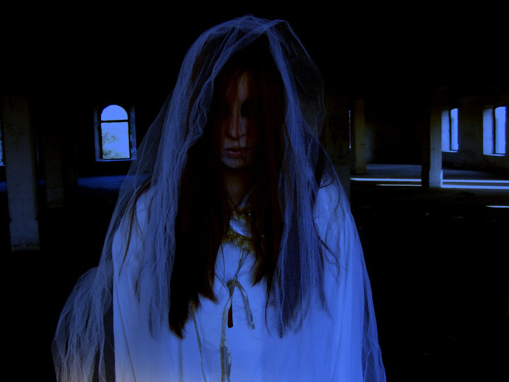 ghost bride in a haunted house, one of the best things to do during Halloween in Seattle