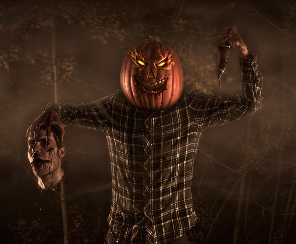 actor dressed up as a pumpkin head holding severed head and knife