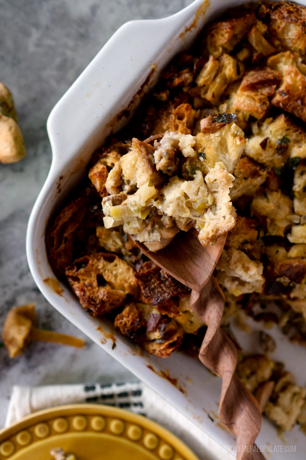 close up of sourdough sausage stuffing in a spoon