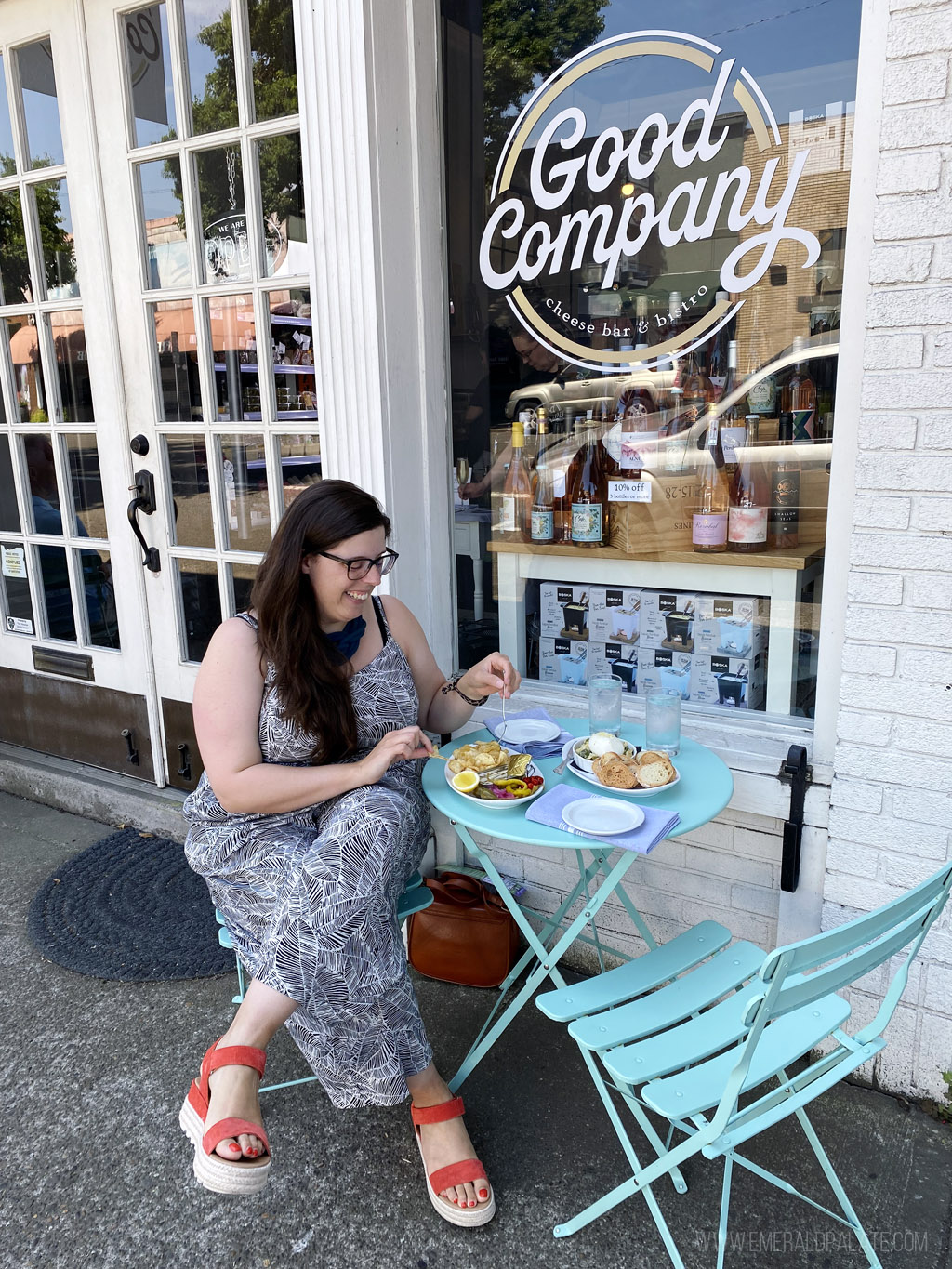 woman enjoying lunch on a bistro table in Newberg, Oregon