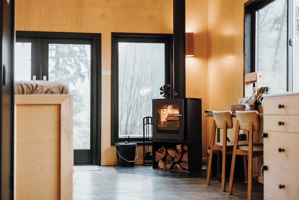 retro wood-fired oven in a modern cabin