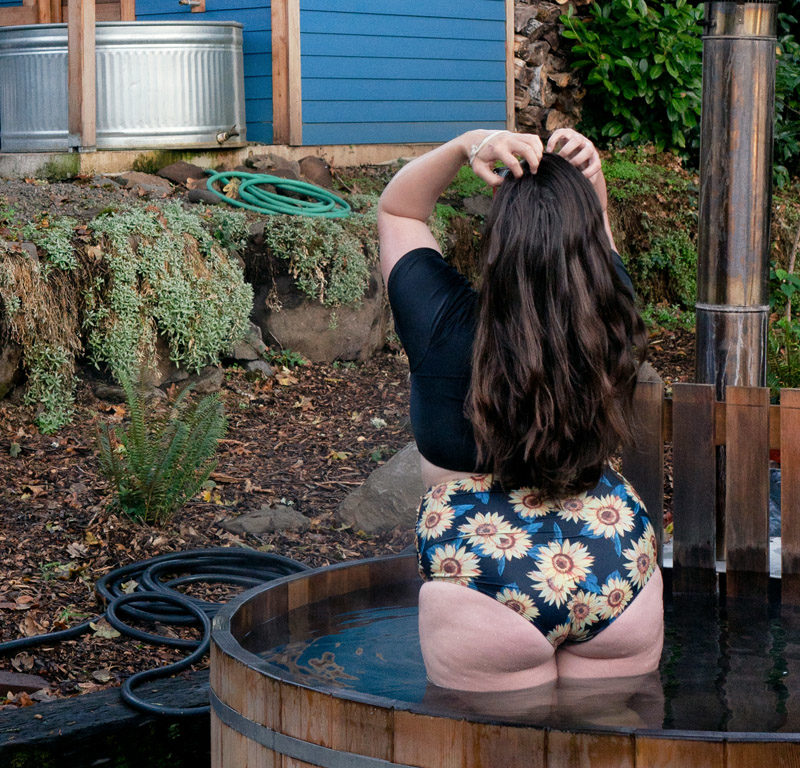 woman in hot tub at one of the best winter cabins in Oregon