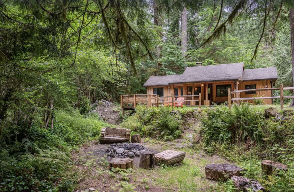 log cabin nestled in the woods