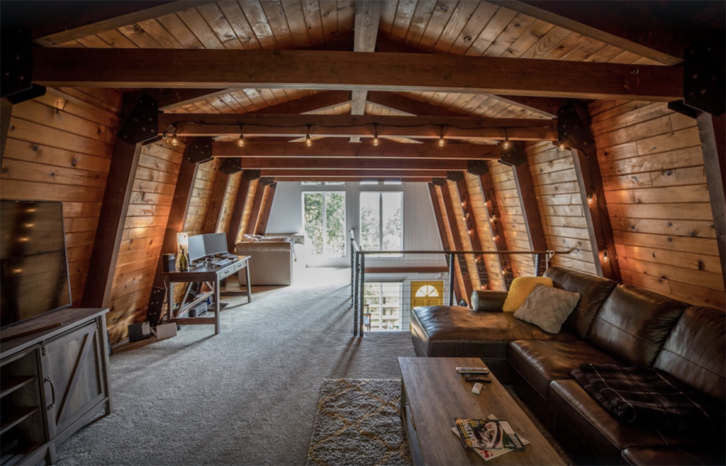 interior of a woody cabin in Oregon with a trapezoidal roof shape