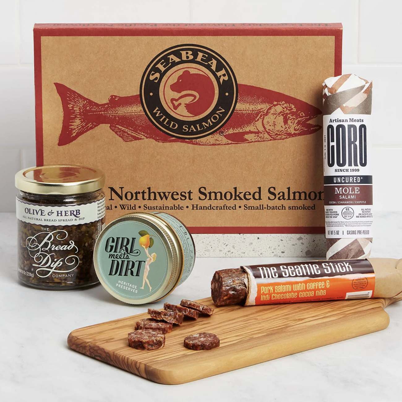 Seattle food gift basket with salmon, charcuterie, jam, and olive spread