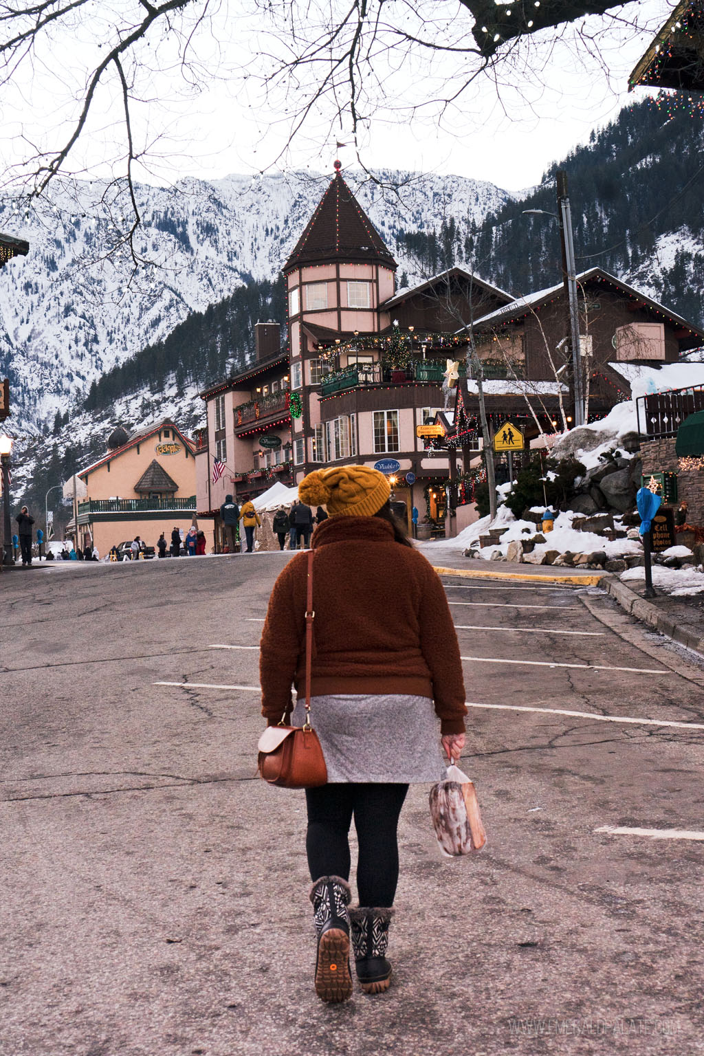 woman walking in downtown Leavenworth in winter | Best Road Trips from Seattle