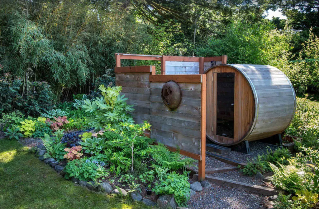 cedar barrel sauna in the backyard of an Oregon cabin