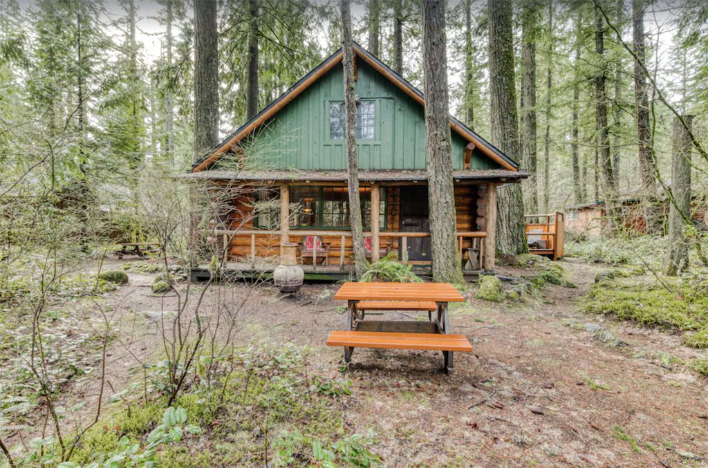 one of the best winter cabins in Oregon tucked in the woods with a picnic table