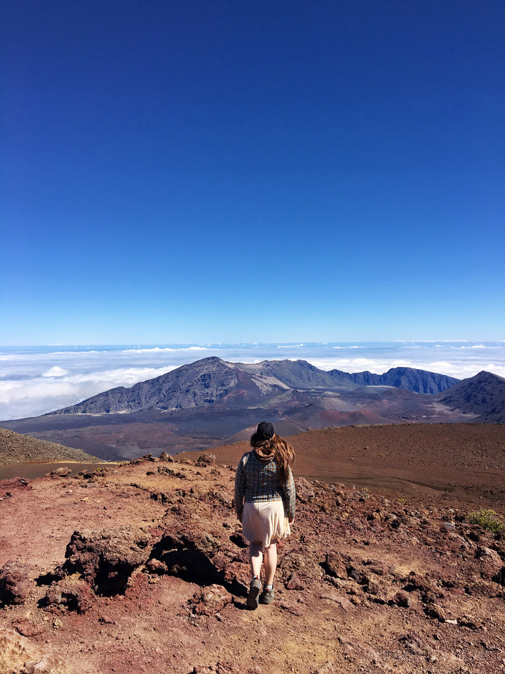 woman walking at Haleakala National Park, home to a bunch of easy hikes on Maui