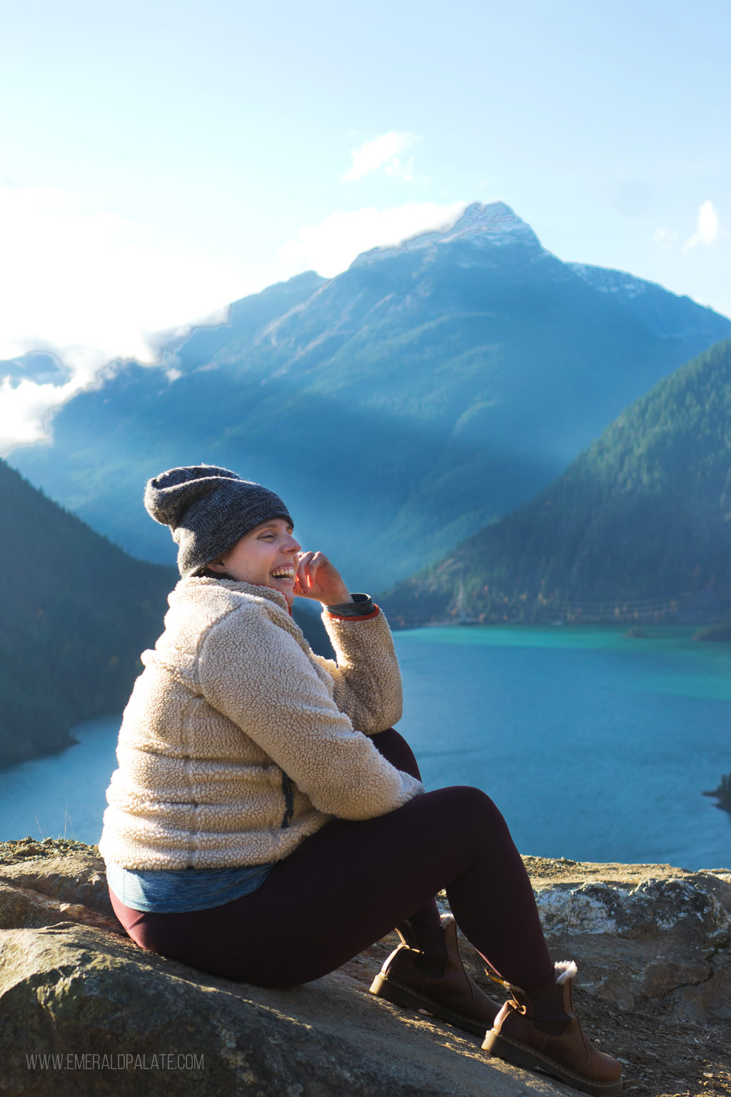 woman laughing at Diablo Lake, a must-visit on your North Cascades National Park itinerary