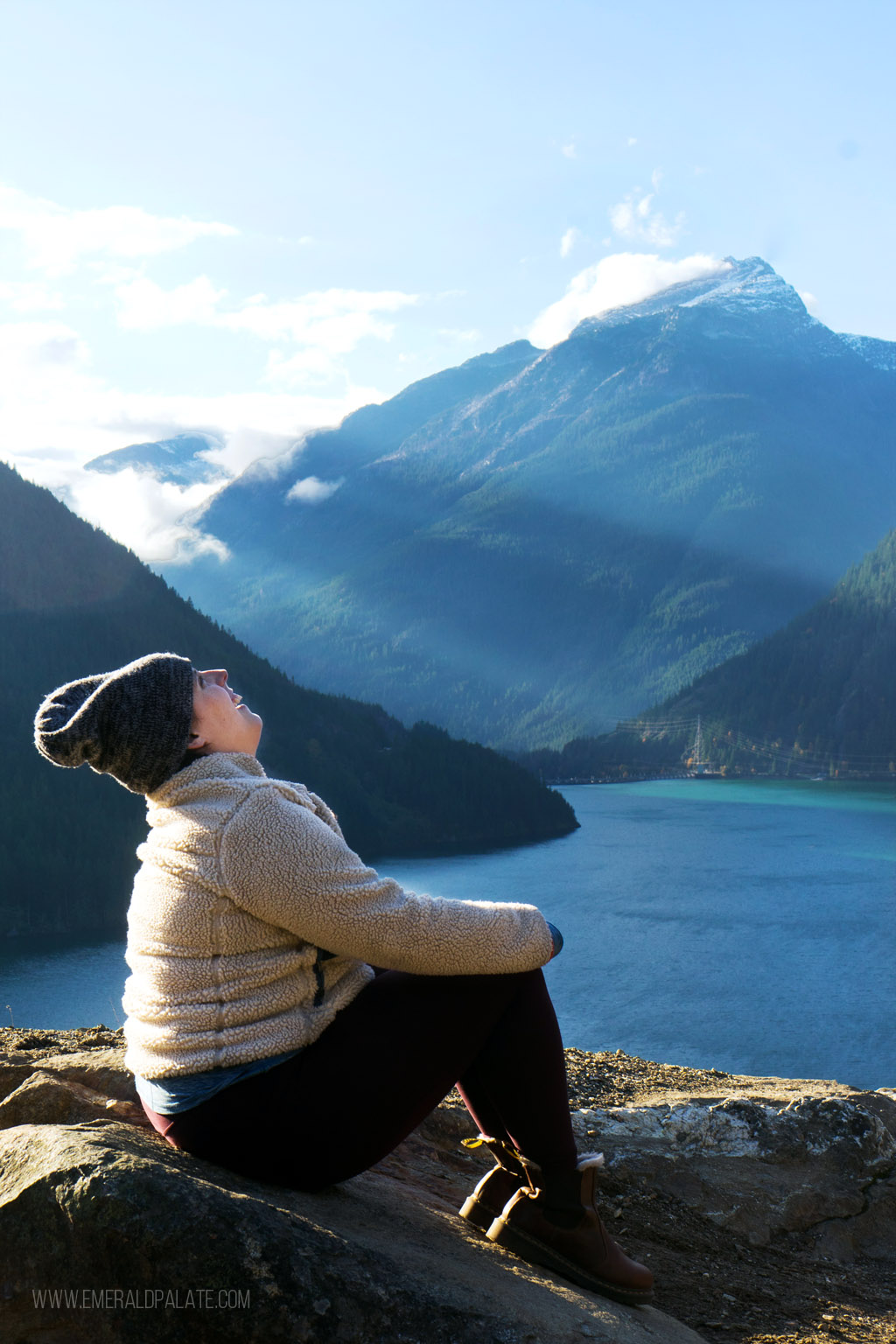 woman laughing at a lookout over Diablo Lake in North Cascades National Park