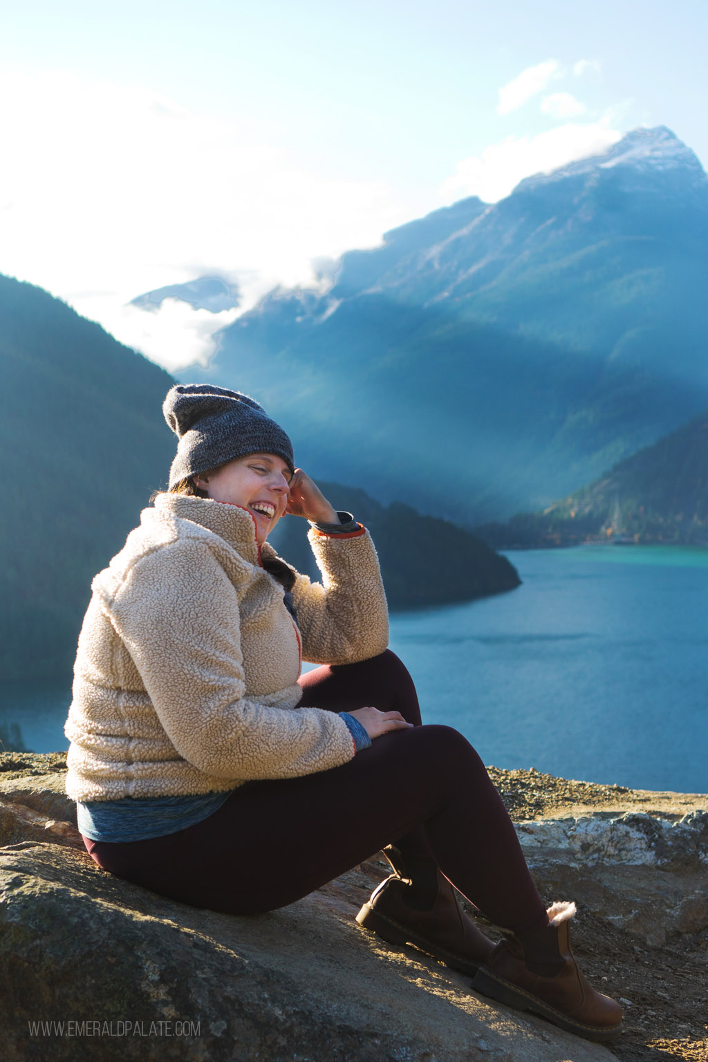 woman laughing in a beanie by Diablo Lake in WA state